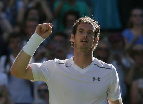 Andy Murray of Britain celebrates after defeating Mikhail Kukushkin of Kazakhstan in their singles first round match at the All England Lawn Tennis Championships in Wimbledon, London, Tuesday June 30, 2015. Murray won the match 6-4, 7-6, 6-4.(AP Photo/Tim Ireland)