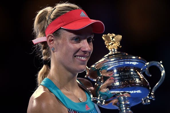 Germany's Angelique Kerber holds the Daphne Akhurst Memorial Cup after her victory during the women's singles final against Serena Williams of the US on day thirteen of the 2016 Australian Open tennis tournament in Melbourne on January 30, 2016. AFP PHOTO / GREG WOOD -- IMAGE RESTRICTED TO EDITORIAL USE - STRICTLY NO COMMERCIAL USE / AFP / GREG WOOD (Photo credit should read GREG WOOD/AFP/Getty Images)