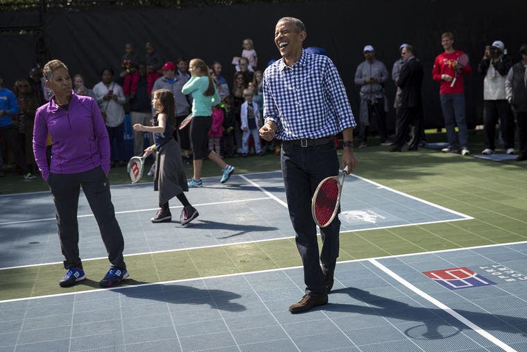 WASHINGTON, DC - MARCH 28: President Barack Obama laughs while playing tennis with children during the annual White House Easter Egg Roll on the South Lawn of the White House March 28, 2016 in Washington, DC. The tradition dates back to 1878 when President Rutherford B. Hayes allowed children to roll eggs on the South Lawn. (Photo by Drew Angerer/Getty Images)
