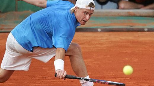 PARIS, France: Australian Lleyton Hewitt hits a backhand during his match against Dutch Martin Verkerk in the third round of the French Open at Roland Garros in Paris 29 May 2004. AFP PHOTO JACK GUEZ (Photo credit should read JACK GUEZ/AFP/Getty Images)