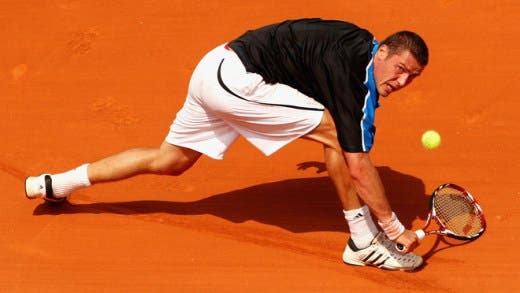 PARIS - MAY 24: Marat Safin of Russia stretches to hit a backhand during his Men's Singles First Round match against Alexandre Sidorenko of France at the French Open on May 24, 2009 in Paris, France. (Photo by Clive Brunskill/Getty Images)