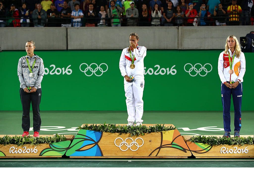 RIO DE JANEIRO, BRAZIL - AUGUST 13:  (L-R) Silver medalist Angelique Kerber of Germany, gold medalist Monica Puig of Puerto Rico and bronze medalist Petra Kvitova of the Czech Republic pose during the medal ceremony for Women's Singles on Day 8 of the Rio 2016 Olympic Games at the Olympic Tennis Centre on August 13, 2016 in Rio de Janeiro, Brazil.  (Photo by Clive Brunskill/Getty Images)